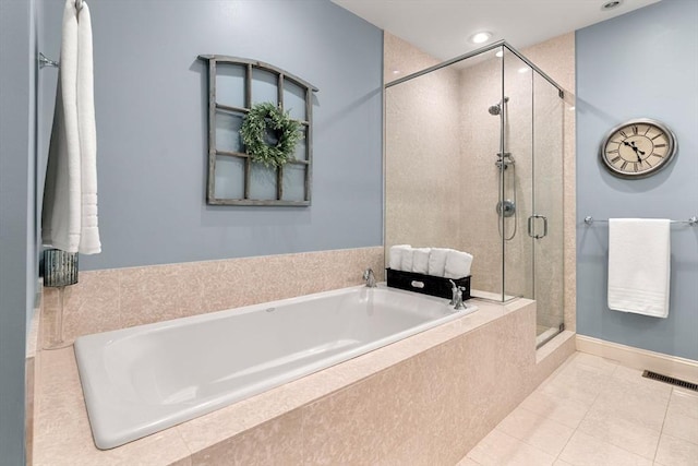 full bathroom featuring tile patterned flooring, a stall shower, a bath, and visible vents