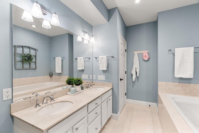 bathroom with a sink, tile patterned flooring, and a garden tub