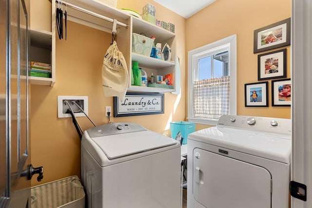 washroom with washer and dryer and laundry area