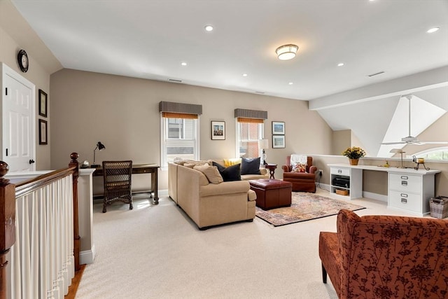 living area with baseboards, light carpet, recessed lighting, and lofted ceiling