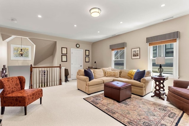 living room with visible vents, recessed lighting, and carpet floors