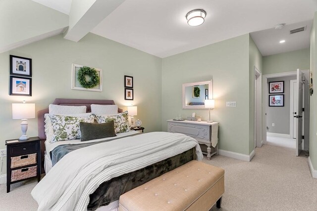 bedroom with visible vents, baseboards, vaulted ceiling with beams, and light colored carpet