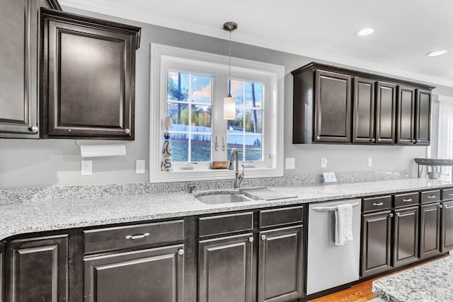 kitchen featuring ornamental molding, dark brown cabinetry, hanging light fixtures, sink, and stainless steel dishwasher