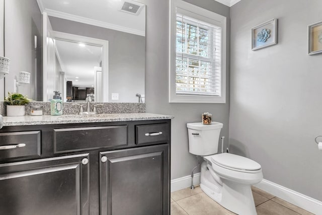 bathroom with crown molding, tile patterned flooring, vanity, and toilet