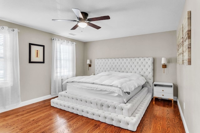 bedroom featuring ceiling fan and wood-type flooring