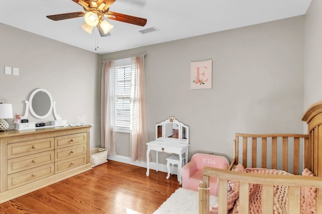 bedroom featuring ceiling fan and light hardwood / wood-style flooring