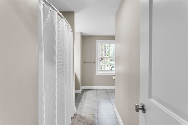 bathroom with tile patterned floors