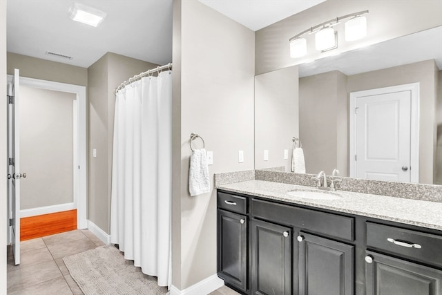 bathroom featuring vanity and tile patterned flooring