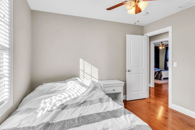 bedroom featuring ceiling fan and light hardwood / wood-style floors