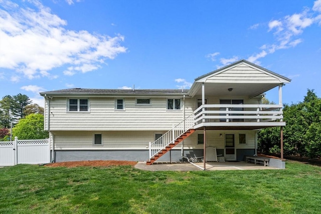 rear view of house featuring a patio, a wooden deck, and stairs