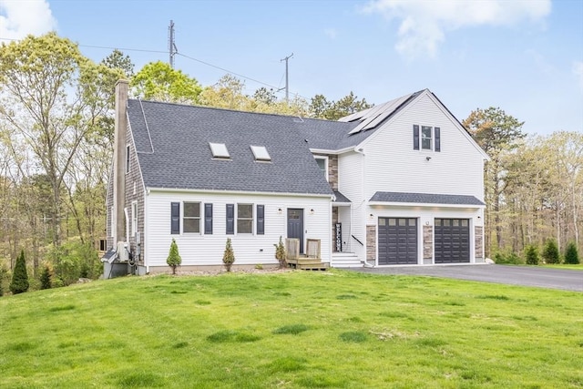 115 Kiahs Way, Sandwich, MA 02537 - view of front facade featuring a chimney, driveway, a front yard, an attached garage, and a shingled roof
