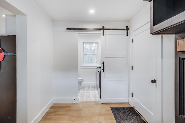 115 Kiahs Way, Sandwich, MA 02537 - foyer featuring light wood-style floors, baseboards, a barn door, and recessed lighting