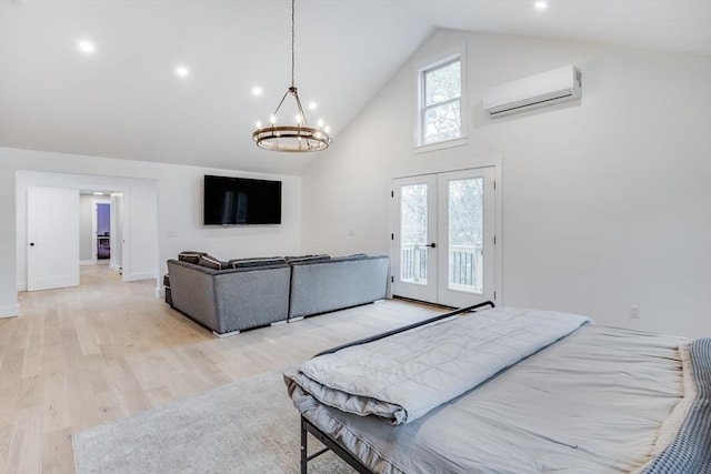 115 Kiahs Way, Sandwich, MA 02537 - bedroom with an AC wall unit, high vaulted ceiling, access to exterior, french doors, and light wood-style floors