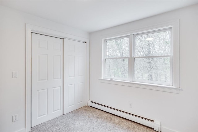 115 Kiahs Way, Sandwich, MA 02537 - unfurnished bedroom with a baseboard heating unit, carpet, and a closet