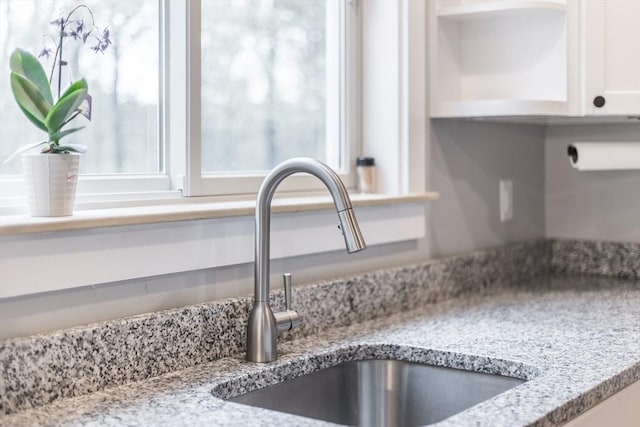 115 Kiahs Way, Sandwich, MA 02537 - kitchen view of a sink, white cabinets, and light stone counters