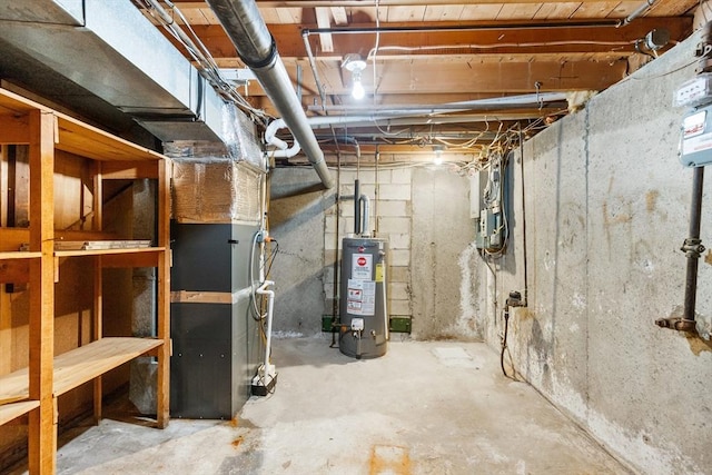 basement featuring heating unit and gas water heater