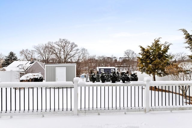 view of snow covered gate