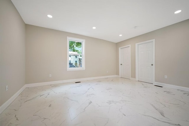 41 Adams St, Fairhaven, MA 02719 - empty room with light marble finish floors and recessed lighting