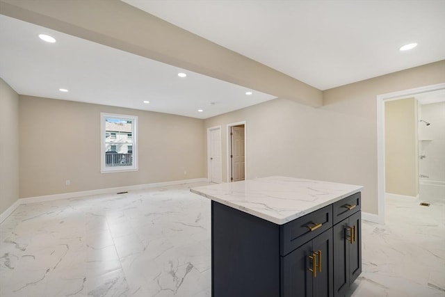41 Adams St, Fairhaven, MA 02719 - kitchen featuring light marble finish floors, recessed lighting, open floor plan, a center island, and light stone counters