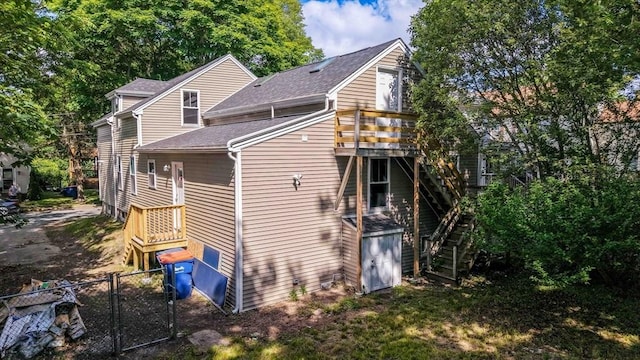 41 Adams St, Fairhaven, MA 02719 - back of property featuring stairway, a shingled roof, a gate, and a wooden deck