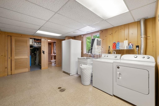 181 Thayer Farms Rd, Attleboro, MA 02703 - washroom with light floors, independent washer and dryer, wood walls, and a sink