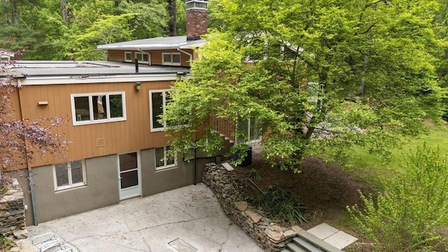 181 Thayer Farms Rd, Attleboro, MA 02703 - back of house with a patio and a chimney
