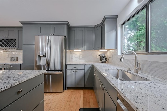 9 Country Club Ln Unit A, Milford, MA 01757 - kitchen featuring stainless steel refrigerator with ice dispenser, tasteful backsplash, gray cabinets, and light stone countertops
