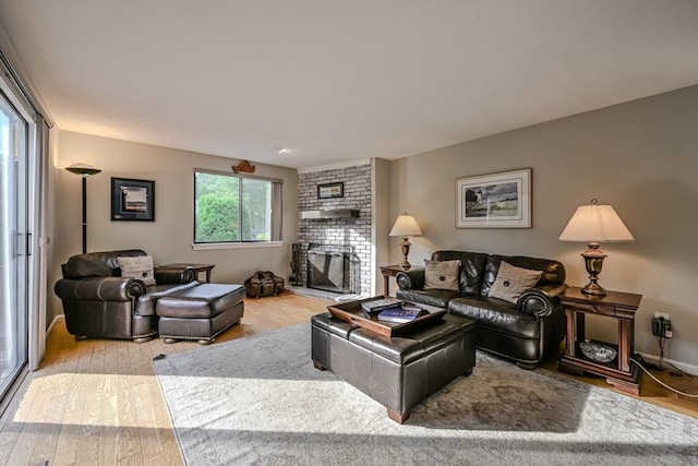 9 Country Club Ln Unit A, Milford, MA 01757 - living area with wood finished floors and a fireplace