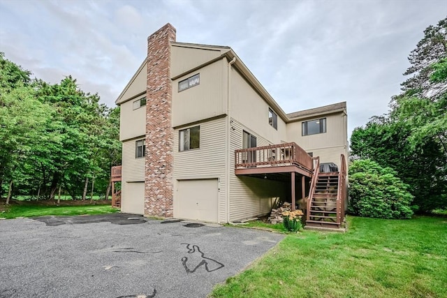 9 Country Club Ln Unit A, Milford, MA 01757 - back of house with stairway, a deck, a chimney, asphalt driveway, and an attached garage
