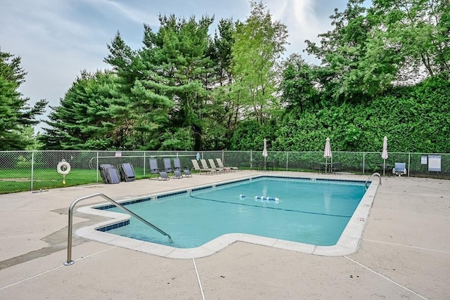 9 Country Club Ln Unit A, Milford, MA 01757 - community pool featuring a patio and view of wooded area