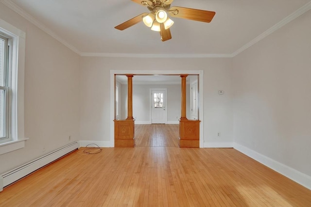 unfurnished room featuring ceiling fan, light wood-type flooring, crown molding, and a baseboard heating unit