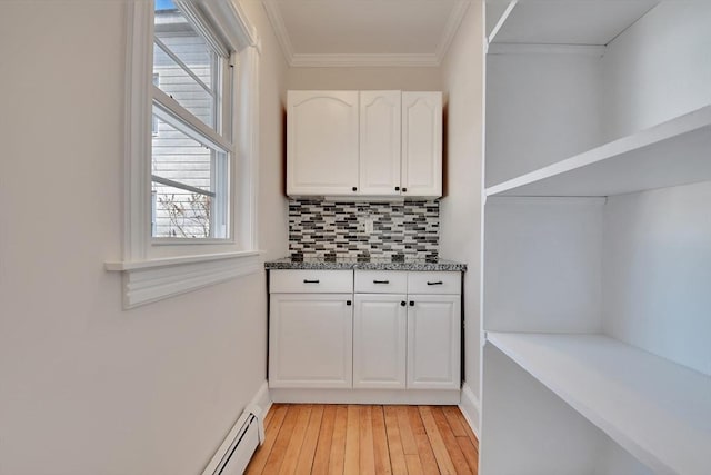 interior space with light hardwood / wood-style floors and crown molding