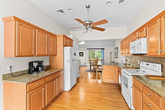 11 Quashnet Woods Dr, Mashpee, MA 02649 - kitchen featuring white appliances, light wood-style floors, ceiling fan, tasteful backsplash, and stone countertops