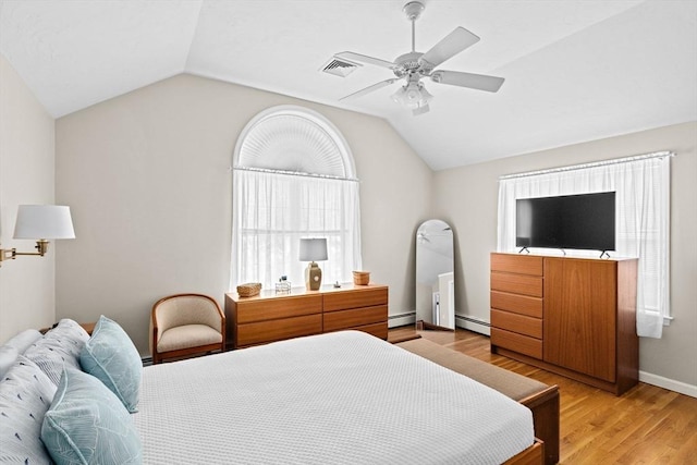 11 Quashnet Woods Dr, Mashpee, MA 02649 - bedroom with a baseboard heating unit, lofted ceiling, light wood finished floors, and ceiling fan