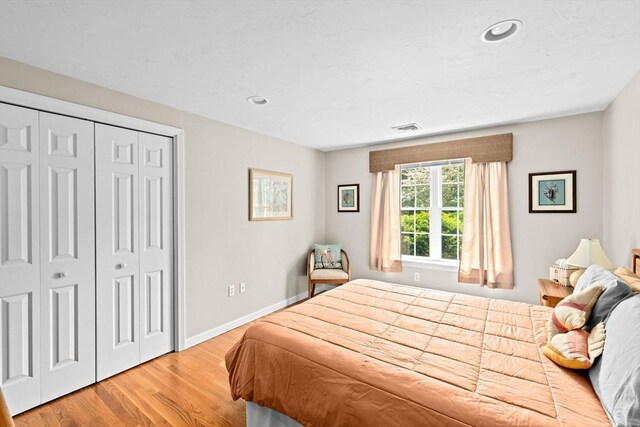 11 Quashnet Woods Dr, Mashpee, MA 02649 - bedroom with wood finished floors, a closet, and recessed lighting