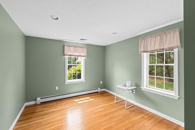 11 Quashnet Woods Dr, Mashpee, MA 02649 - empty room featuring baseboard heating, wood finished floors, and recessed lighting