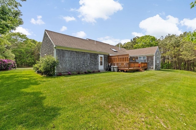 11 Quashnet Woods Dr, Mashpee, MA 02649 - rear view of property with a wooden deck and a yard