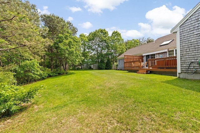 11 Quashnet Woods Dr, Mashpee, MA 02649 - view of grassy yard featuring a deck
