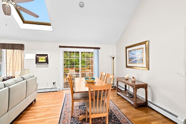 11 Quashnet Woods Dr, Mashpee, MA 02649 - dining area with ceiling fan, vaulted ceiling, light wood-style floors, a baseboard radiator, and a skylight