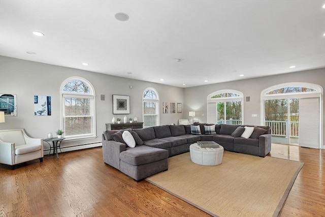 living room featuring hardwood / wood-style floors and baseboard heating