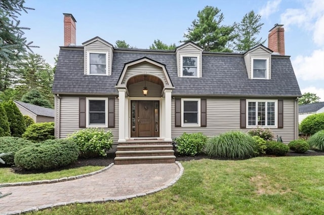 35 Crest Rd, Lynnfield, MA 01940 - view of front of property with a chimney, a front yard, and a shingled roof