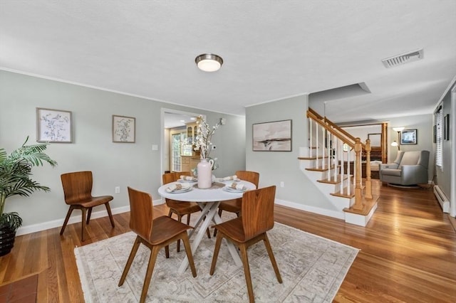 35 Crest Rd, Lynnfield, MA 01940 - dining space featuring stairway, wood finished floors, and baseboard heating