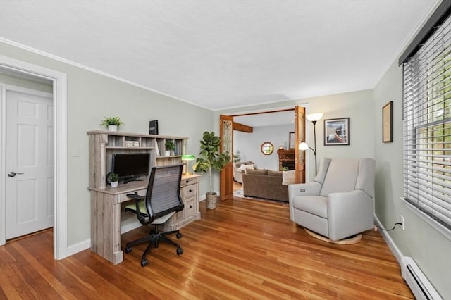 35 Crest Rd, Lynnfield, MA 01940 - home office with baseboard heating, wood finished floors, and ornamental molding