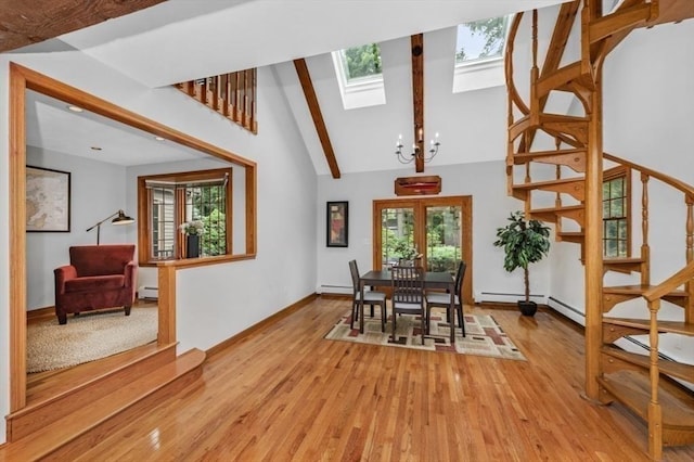 35 Crest Rd, Lynnfield, MA 01940 - dining room with a skylight, stairs, beamed ceiling, light wood-style flooring, and a baseboard radiator