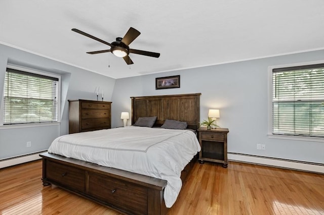 35 Crest Rd, Lynnfield, MA 01940 - bedroom with multiple windows, a baseboard radiator, crown molding, wood finished floors, and ceiling fan