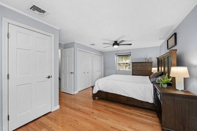 35 Crest Rd, Lynnfield, MA 01940 - bedroom featuring light wood-type flooring, crown molding, multiple closets, and ceiling fan
