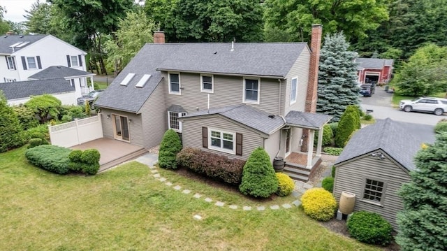 35 Crest Rd, Lynnfield, MA 01940 - back of property featuring a chimney, a shingled roof, and a porch