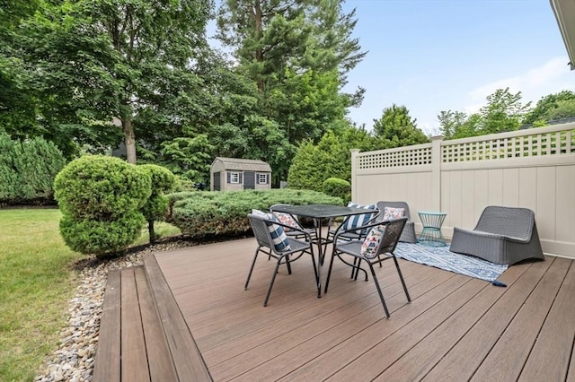 35 Crest Rd, Lynnfield, MA 01940 - wooden deck featuring a shed, outdoor dining area, and view of wooded area