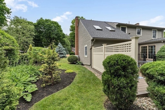 35 Crest Rd, Lynnfield, MA 01940 - view of side of home featuring a chimney and roof with shingles