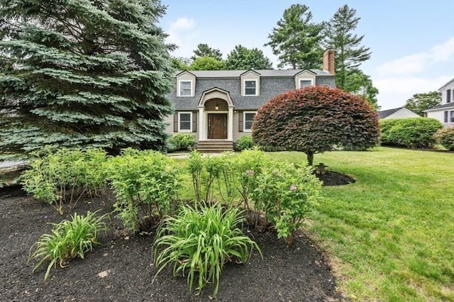 35 Crest Rd, Lynnfield, MA 01940 - view of front facade featuring a chimney, a front lawn, and a gambrel roof